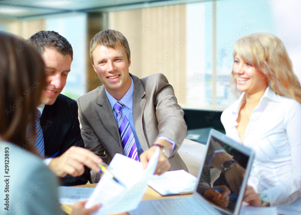 a successful business team with a document on a table a successful business team with a document on a table