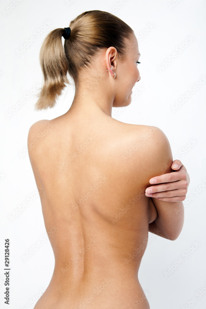 Back of nude beautiful girl on grey background. Back of nude beautiful girl on grey background.