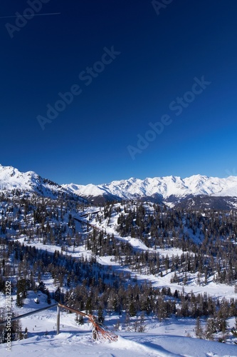 Italian mountains over blue clear sky in winter