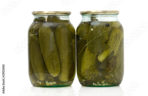 Glass jar with pickled cucumbers isolated on white background