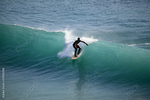 Surfer in ocean photo