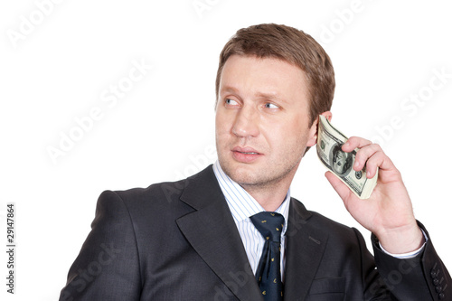 Businessman with pack of dollars