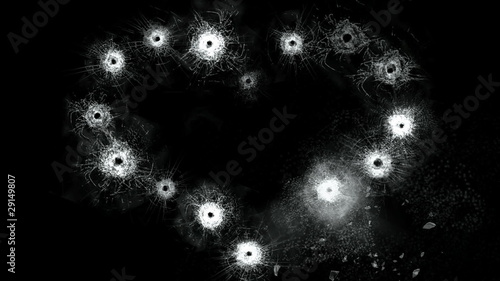 Heart shape of the gunshots in glass