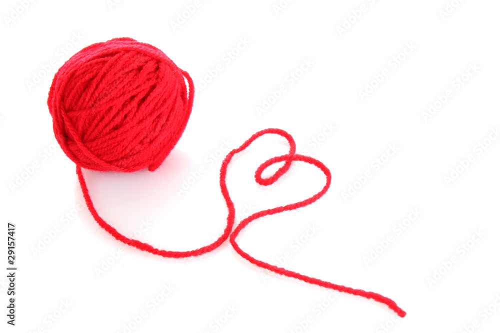 Red ball of woollen red thread isolated on white Red ball of woollen red thread isolated on white