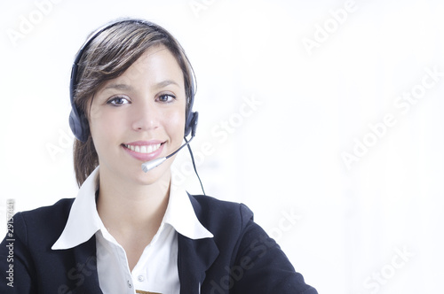 young woman in job; headphones and customer service