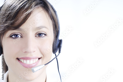 young woman in job; headphones and customer service