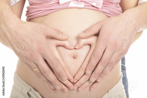 Wallpaper Mural Heart shaped hands of pregnant woman and her husband Torontodigital.ca