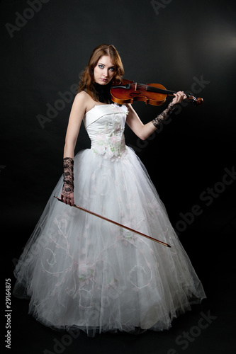 Girl in white dress with violin