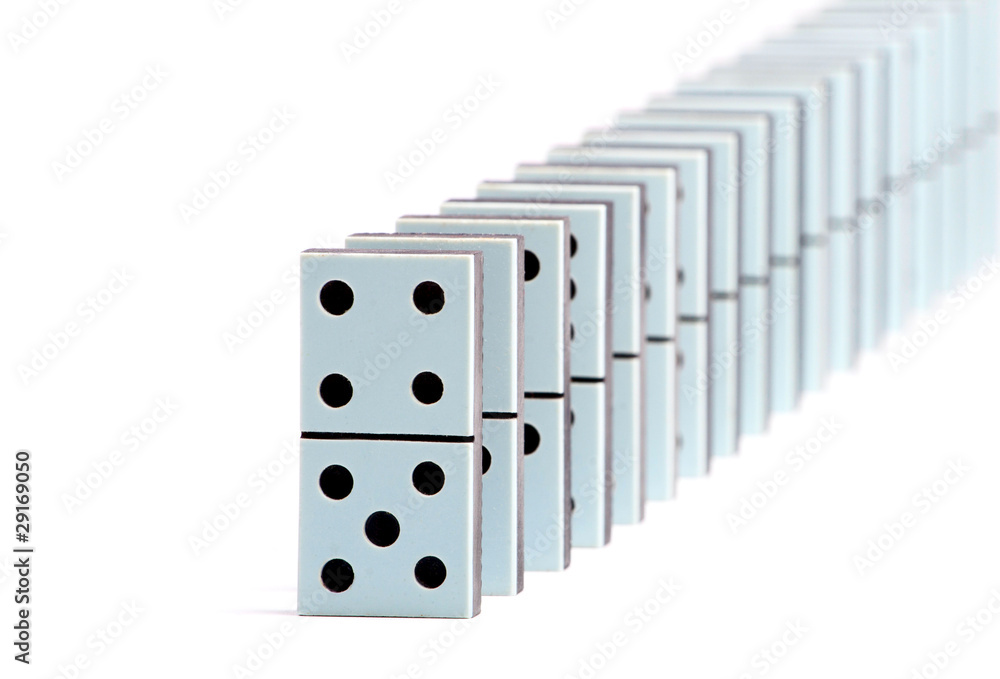 Domino pieces in a line on white background Domino pieces in a line on white background