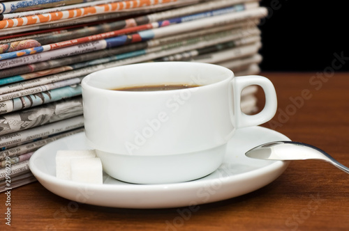 Cup from coffee and the newspaper