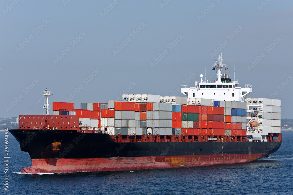 Container ship with load of containers, at sea. Container ship with load of containers, at sea.