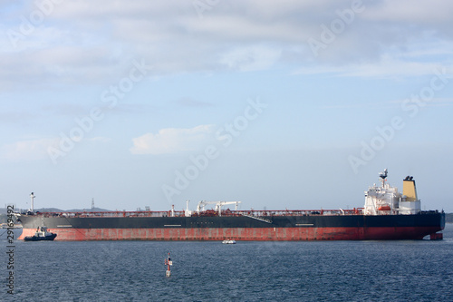 Supertanker ship moored in harbour.