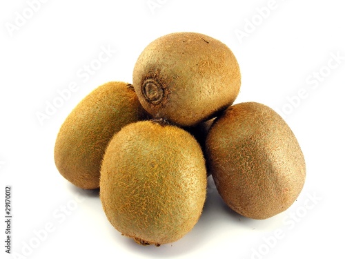 Whole kiwi fruits on a white background