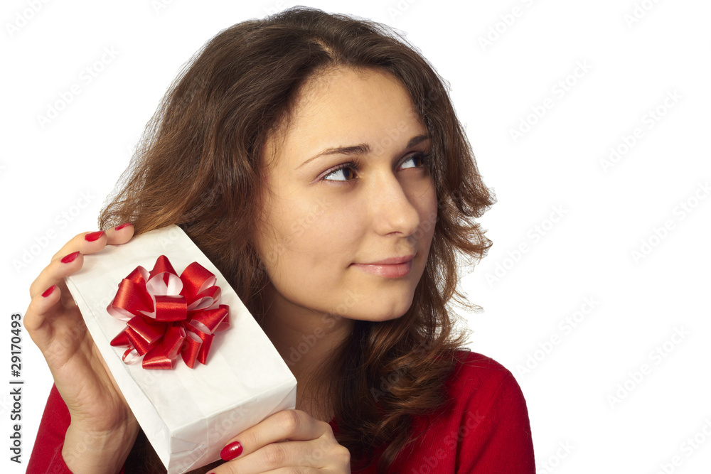 Pretty girl holding a gift. Isolated on white Pretty girl holding a gift. Isolated on white