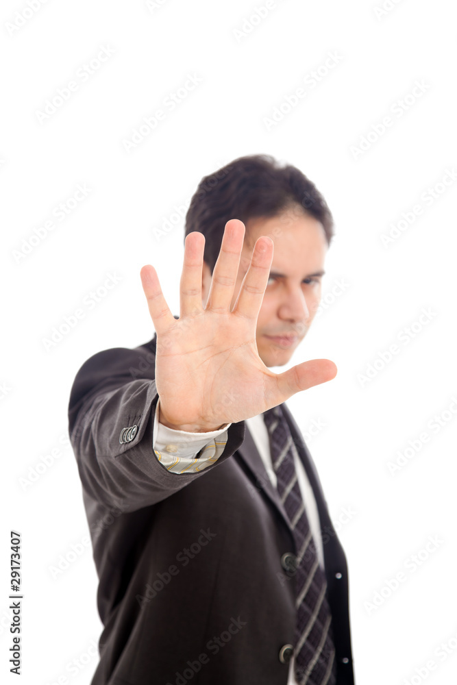 Serious business man making stop gesture, isolated on white