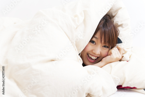 a portrait of beautiful asian woman on the bed