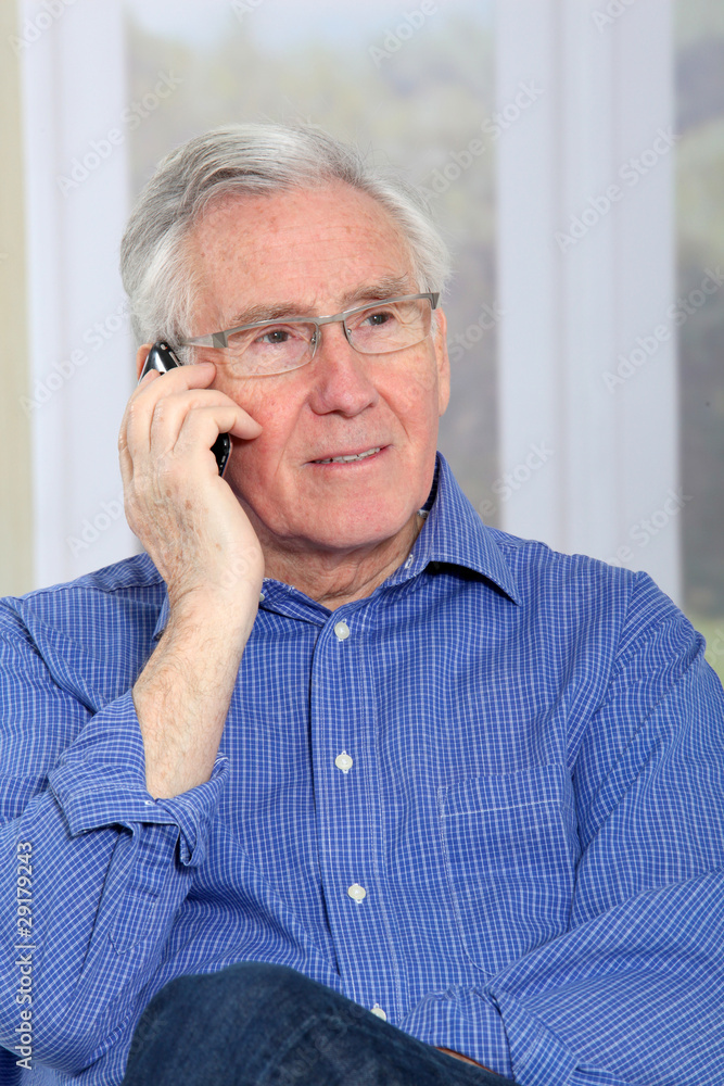 Elderly man talking on mobile phone Elderly man talking on mobile phone