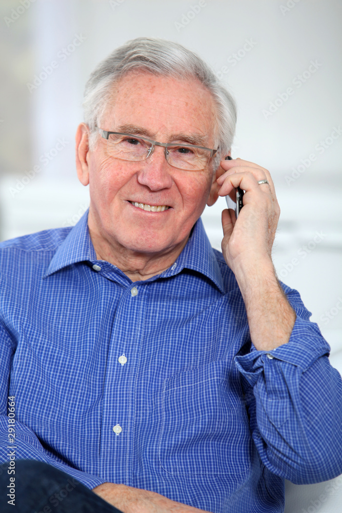Elderly man talking on mobile phone Elderly man talking on mobile phone