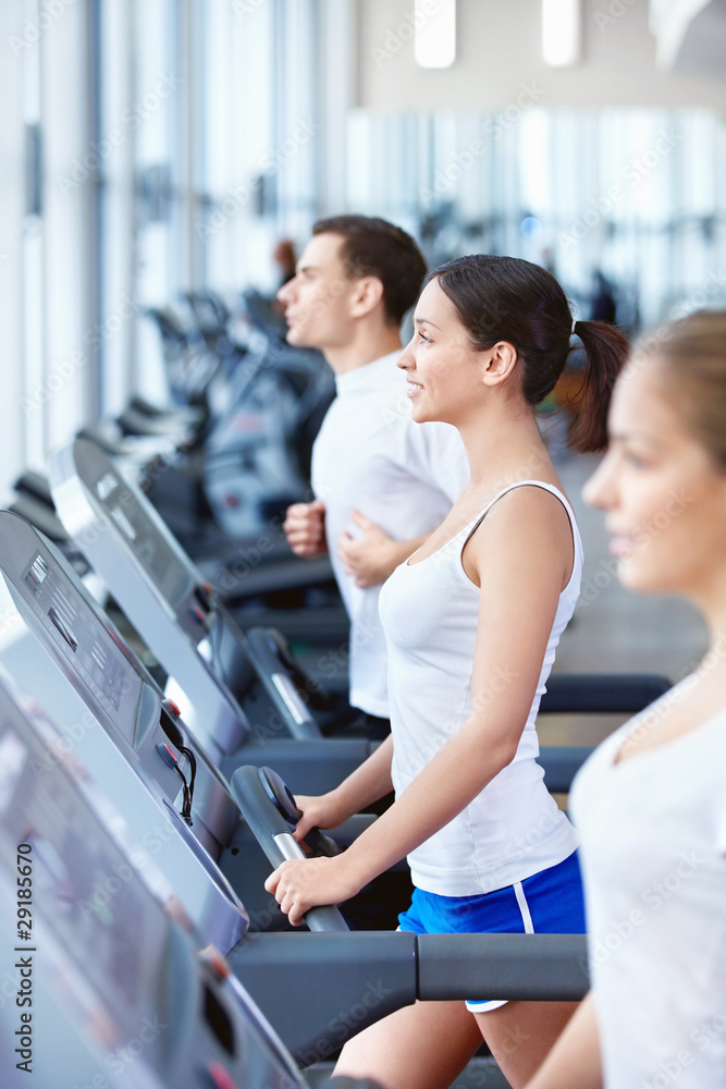Fototapeta premium Sports people on treadmills