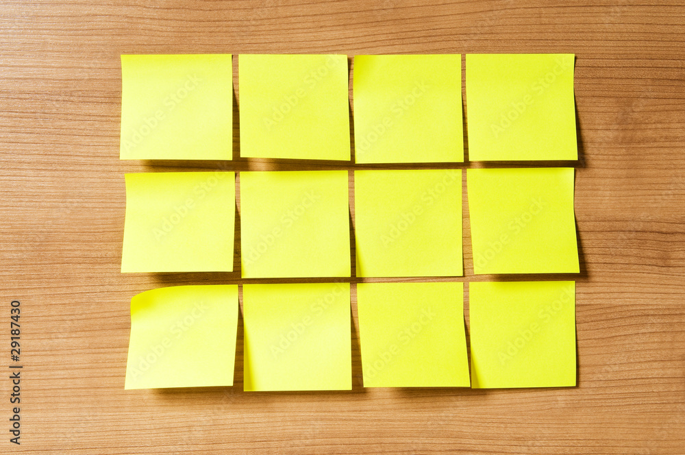 Fototapeta premium Many reminder notes on the wooden background