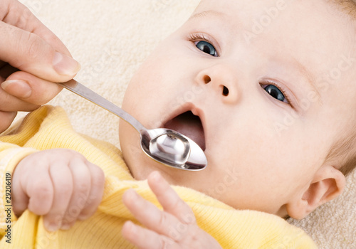 Child is drinking medicine syrup or water