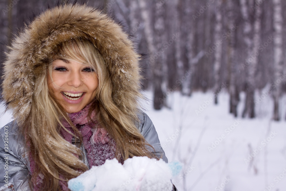 young pretty smiling woman in winter forest young pretty smiling woman in winter forest