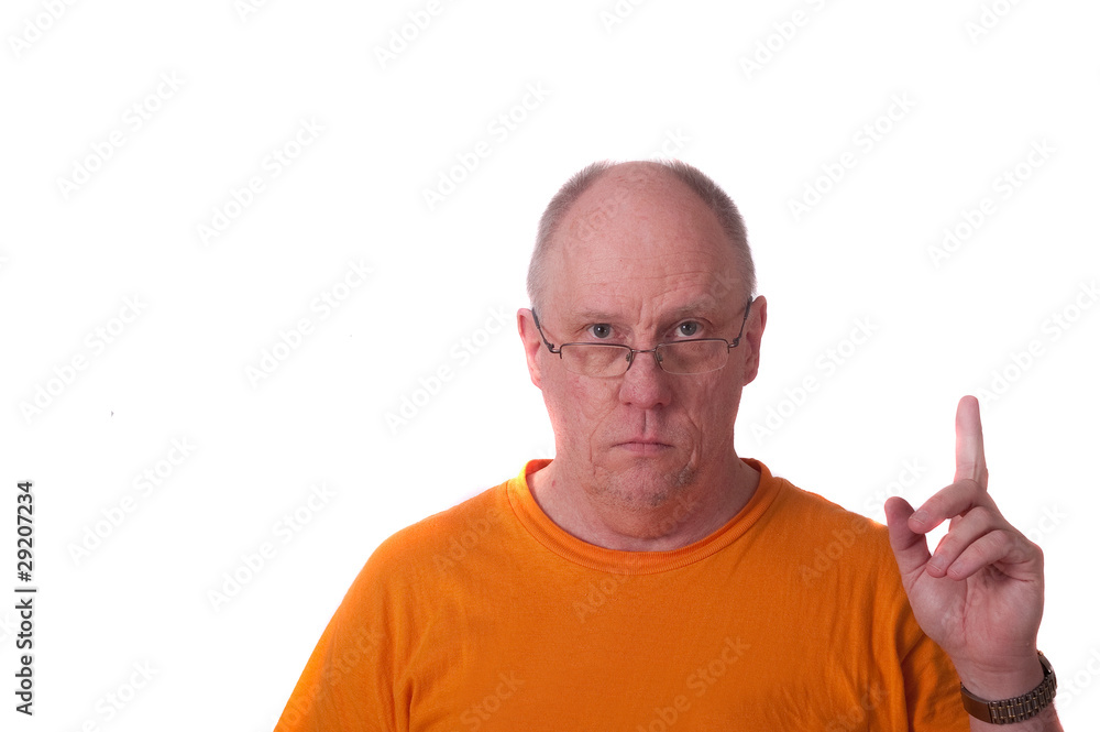 Older Bald Man in Orange Tshirt Pointing Up Older Bald Man in Orange Tshirt Pointing Up