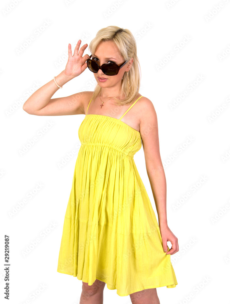 Girl in a yellow summer dress and sunglasses. Girl in a yellow summer dress and sunglasses.
