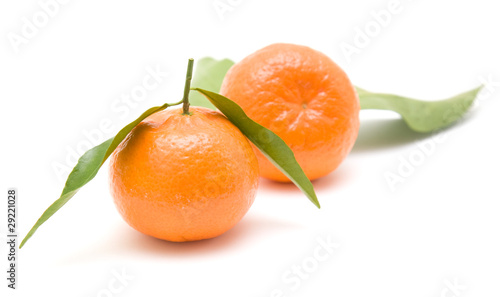 clementines with leaves, isolated on white background