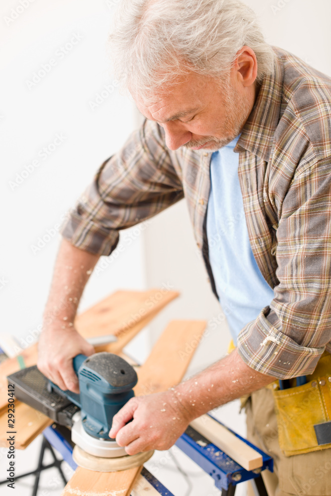 Home improvement - handyman sanding wooden floor Home improvement - handyman sanding wooden floor