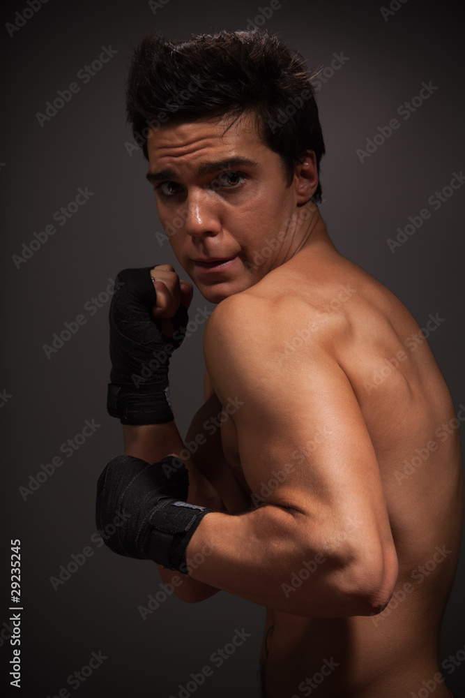 strong man in defensive pose strong man in defensive pose