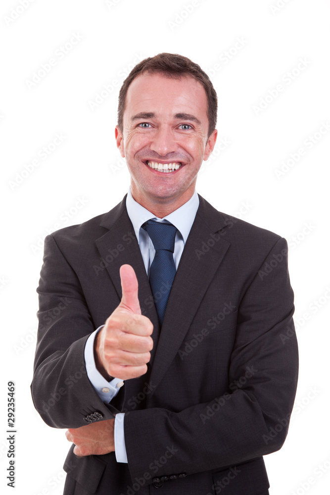 handsome businessman with thumb raised as a sign of success handsome businessman with thumb raised as a sign of success