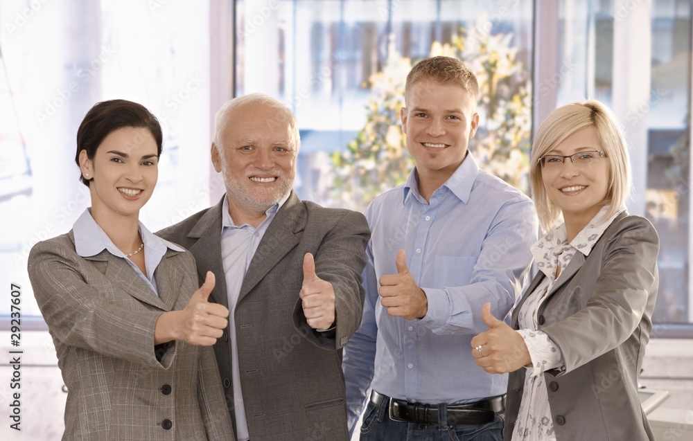 © nyul - Successful businessteam giving thumbs up