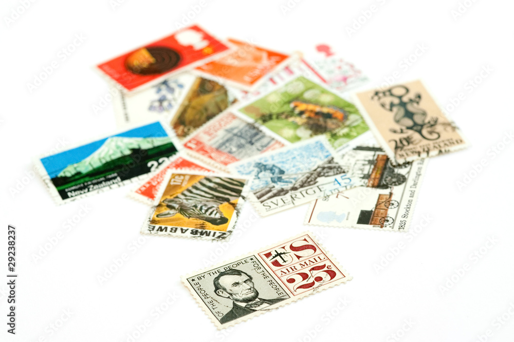 mail stamps from various countries on white mail stamps from various countries on white