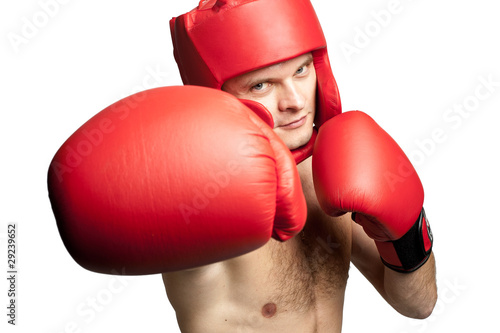 Professional boxer attacking isolated on white background