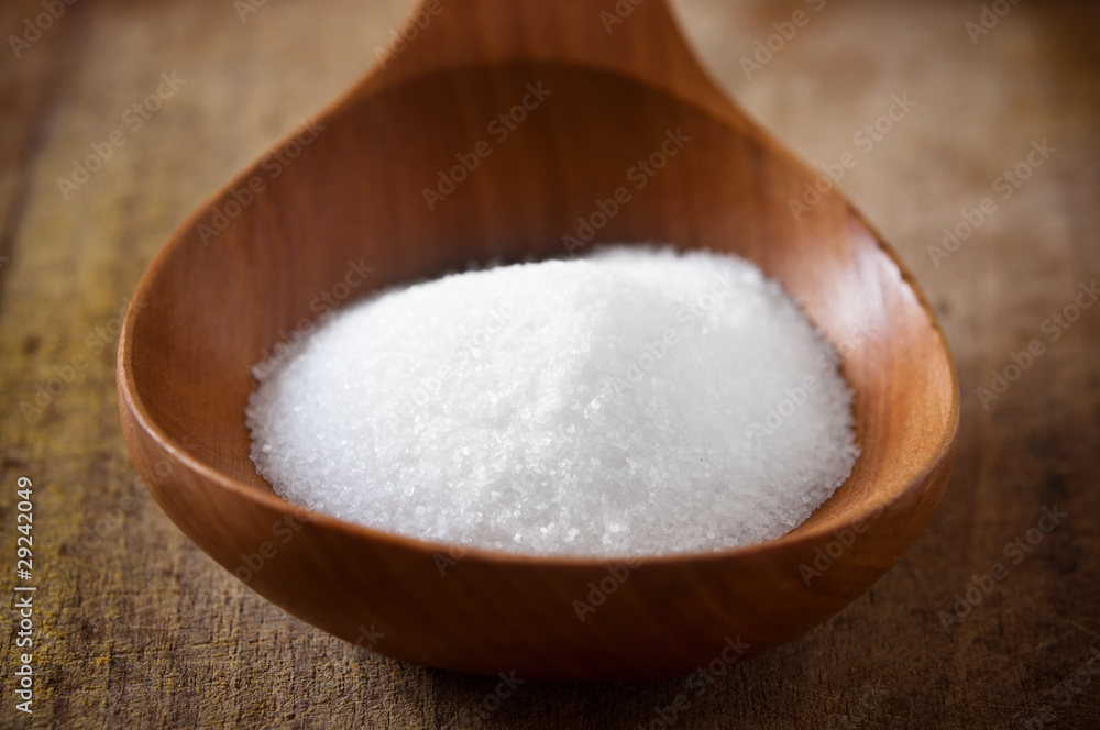 Salt on wooden spoon Salt on wooden spoon