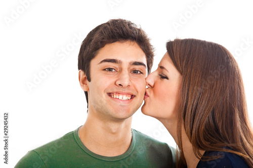 Young kissing couple isolated on white