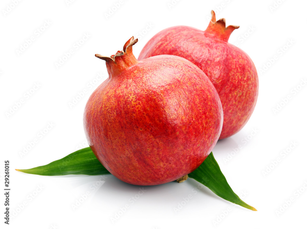 Pomegranate fruits with green leaf isolated Pomegranate fruits with green leaf isolated