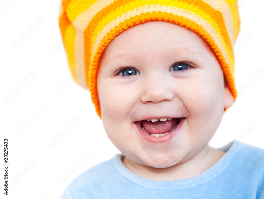 Smiling baby girl showing teeth wearing a hat Smiling baby girl showing teeth wearing a hat