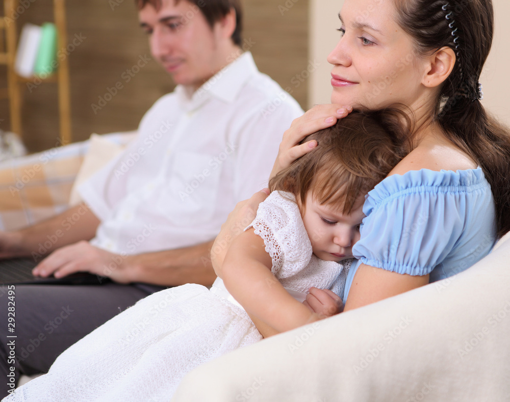 young mother with a daughter at home