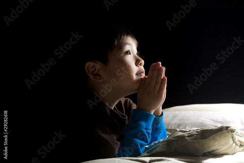 Young boy's bedtime prayer.