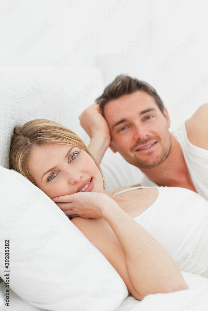 Lovely pairs lying down together in their bed Lovely pairs lying down together in their bed