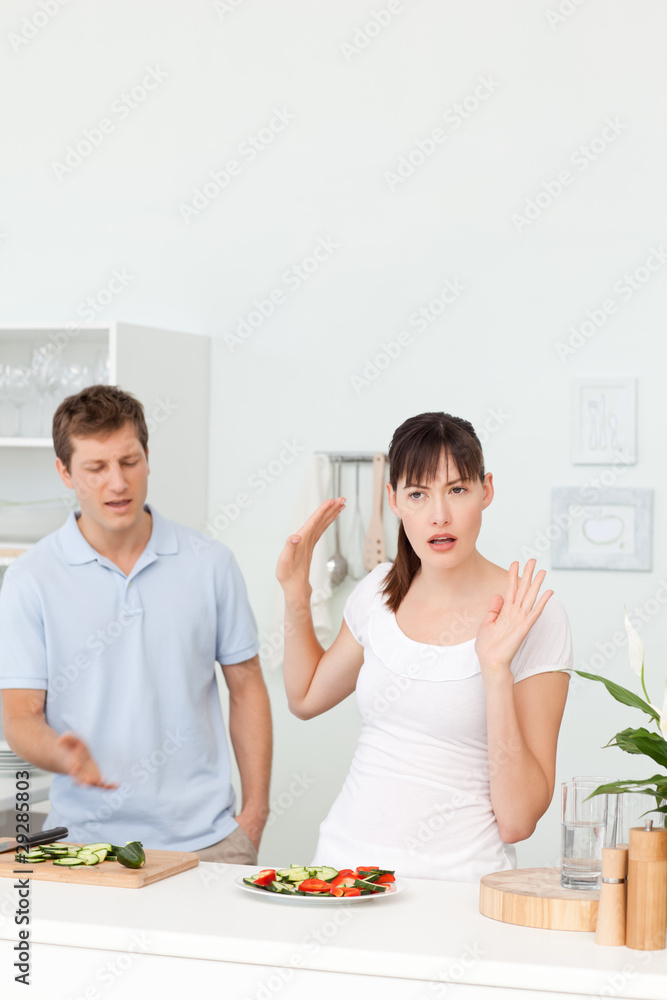 Young lovers having dispute in the kitchen Young lovers having dispute in the kitchen