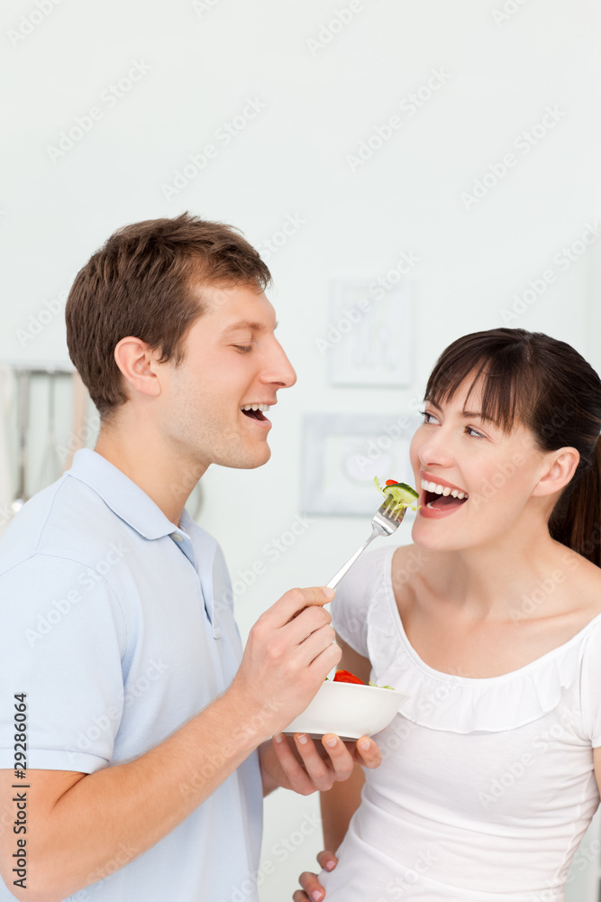 Happy couple eating together Happy couple eating together