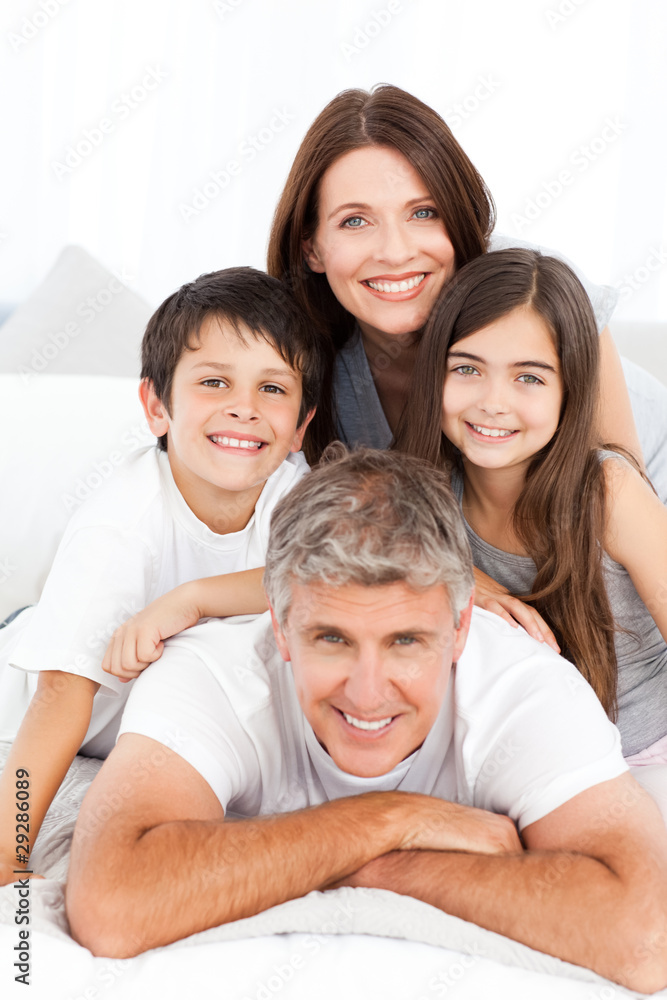 Happy familly looking at the camera Happy familly looking at the camera