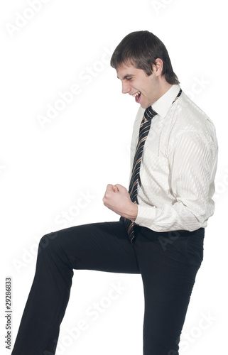 Businessman in suit shows an emotional YEAH!