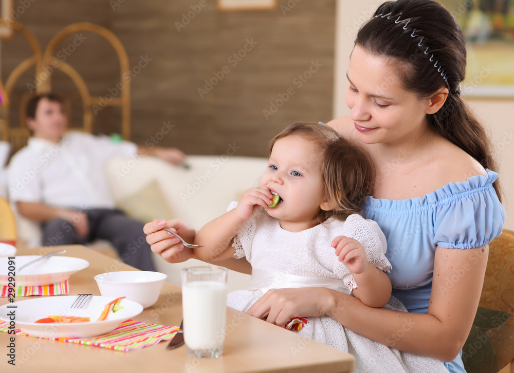 young mother feeding her baby