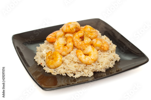 Prawns and fried rice on a plate against white