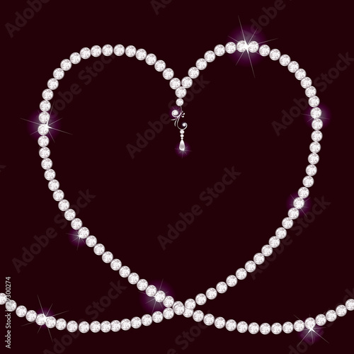 Diamond necklace lying in form of heart
