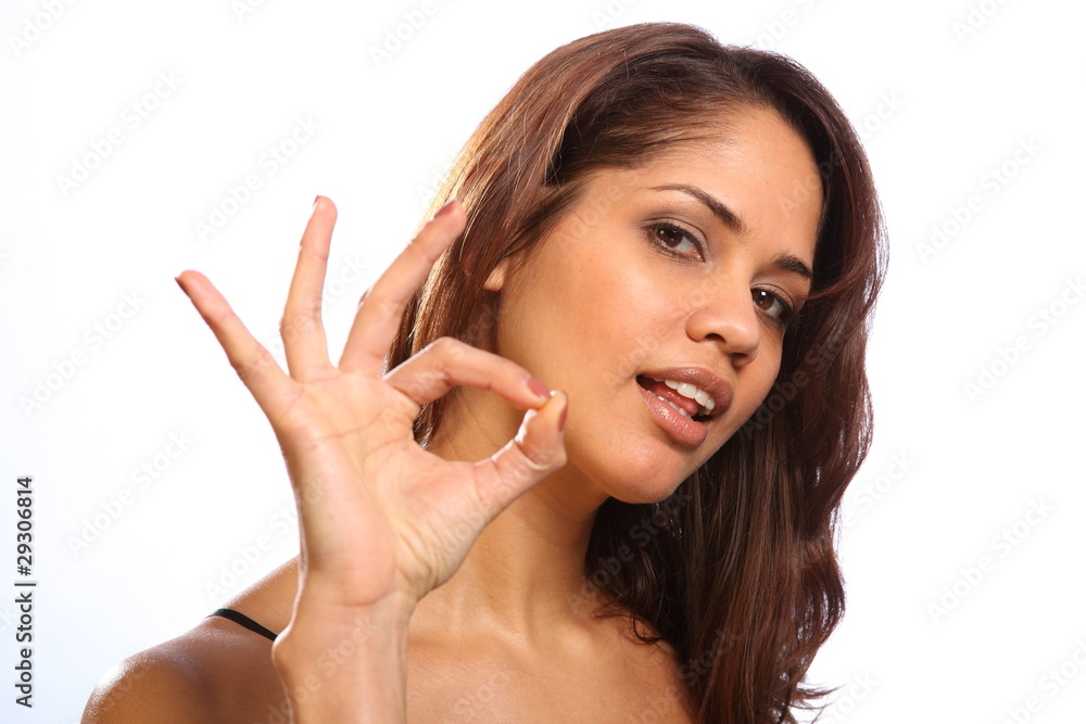 Beautiful young woman gives ok sign to camera Beautiful young woman gives ok sign to camera